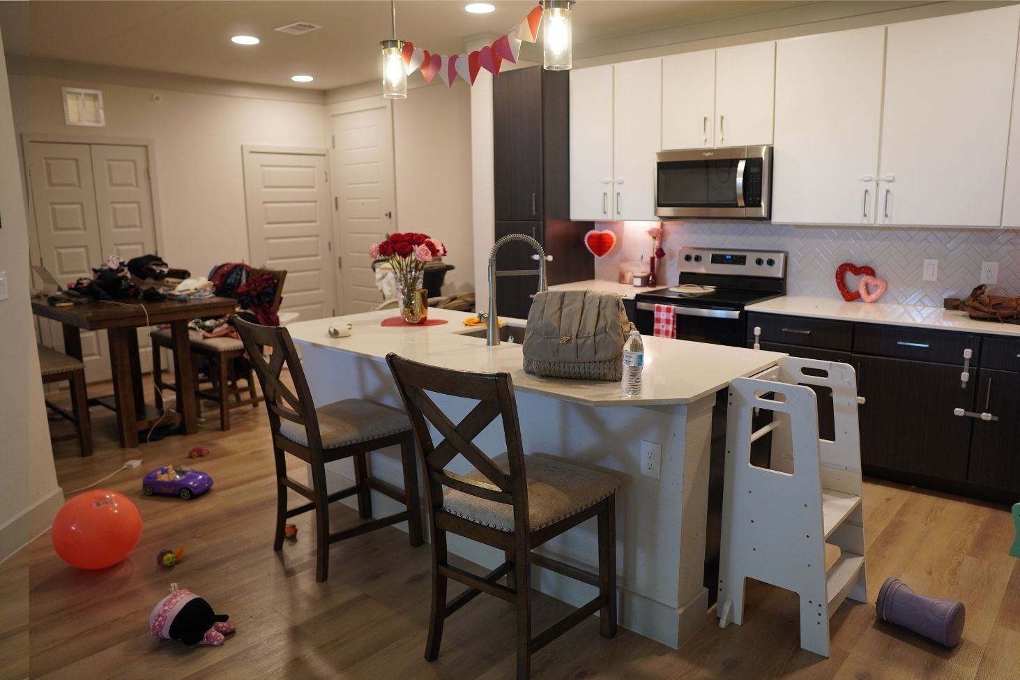 Before cleaning: busy kitchen and dining area before Magnificent cleaned it