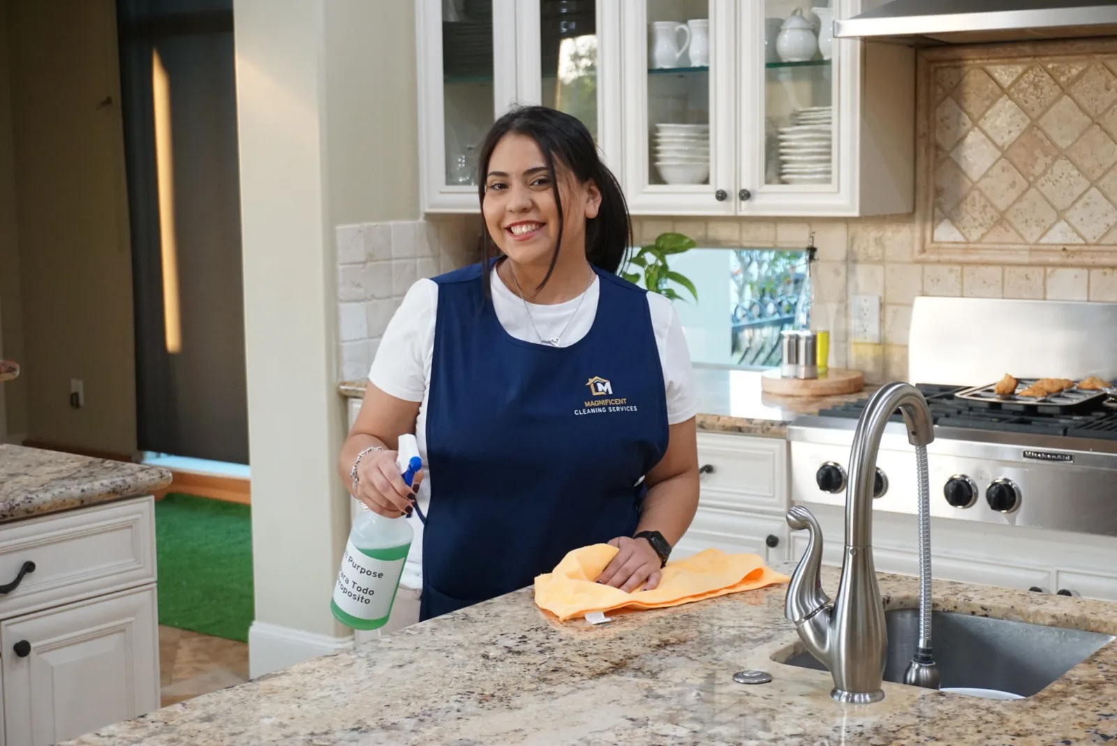 Cleaner in a bright kitchen after move-in or move-out cleaning